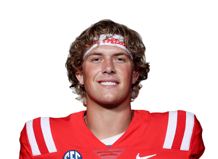 a man in a red jersey holding a football ball