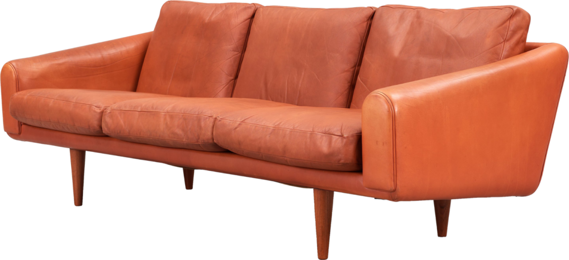an orange leather sofa with wooden legs