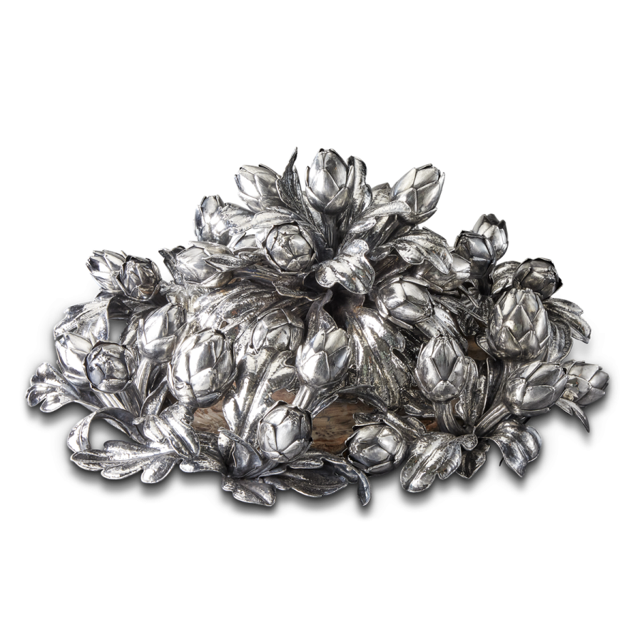 a pile of silver leaves on white background