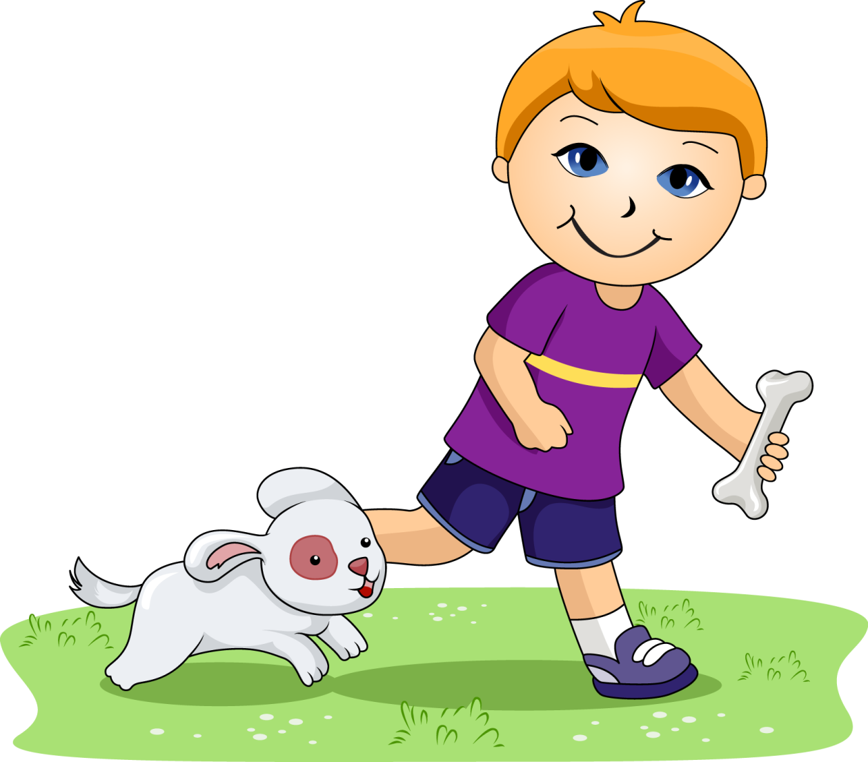 a boy playing with his dog on the grass