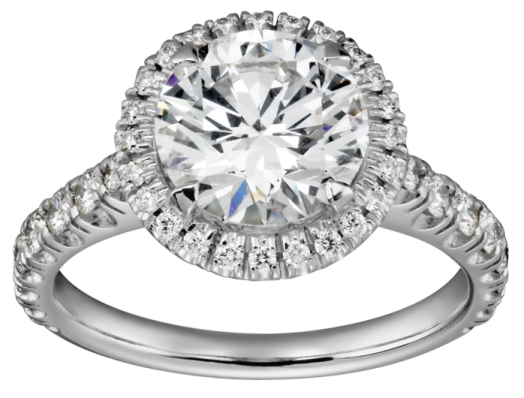 a white gold engagement ring with an oval center surrounded by round diamonds