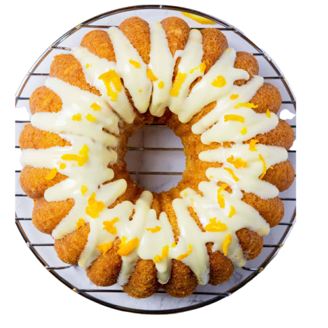 a cake on a wire rack with frosting