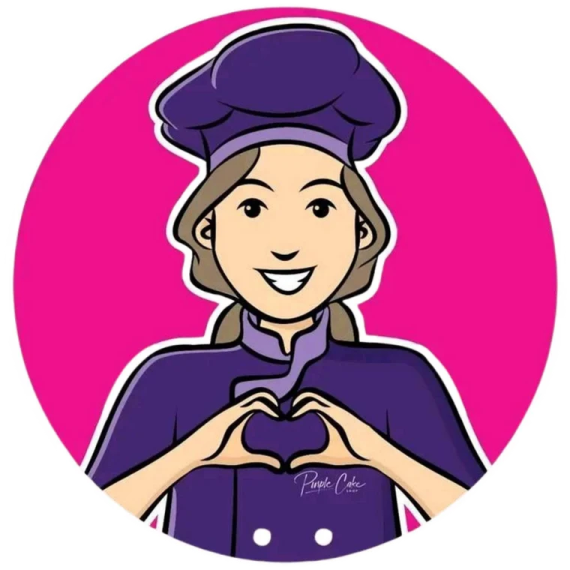 a woman in a chef's uniform making a heart shape