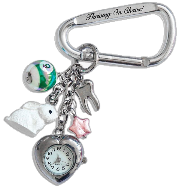 a key chain with a clock and charms