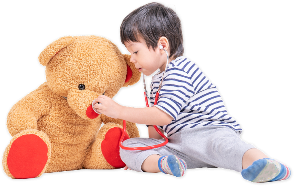 a little boy playing with a teddy bear