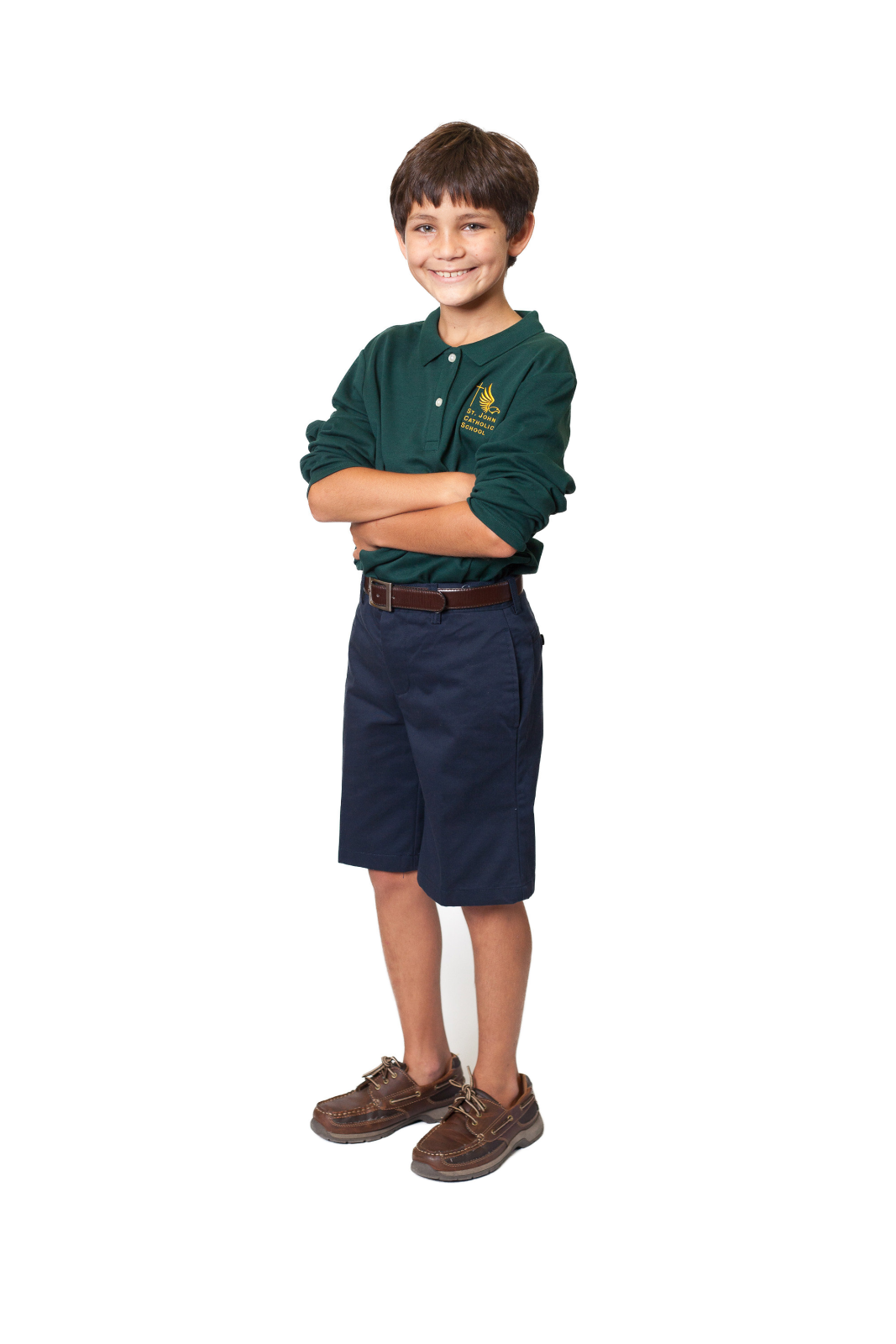 a young boy standing with his arms crossed