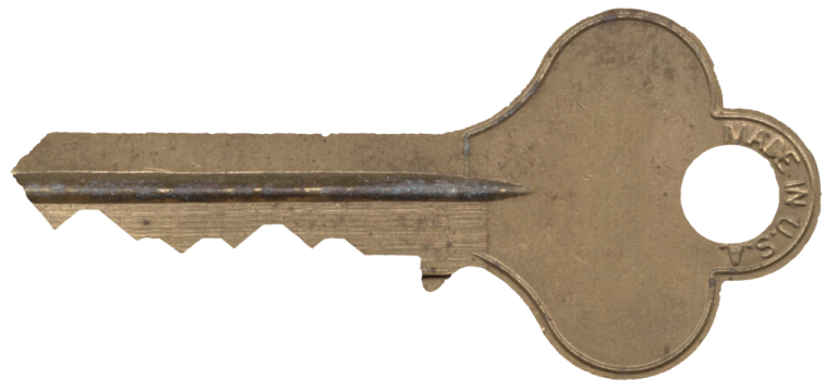 an old key on a white background