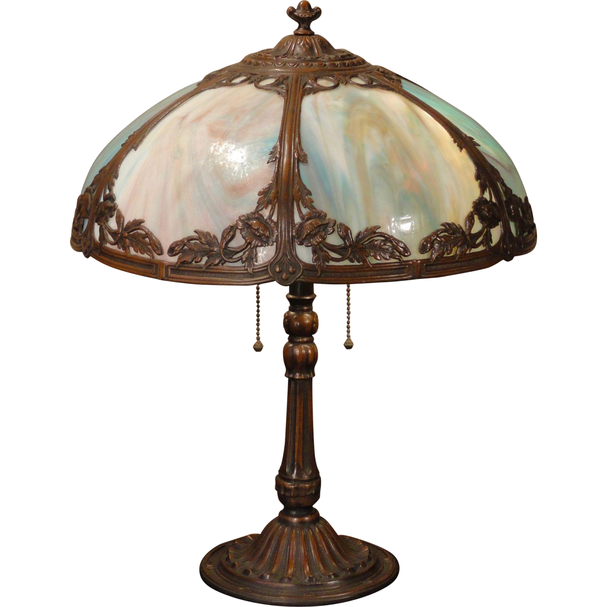 an antique table lamp with a glass shade
