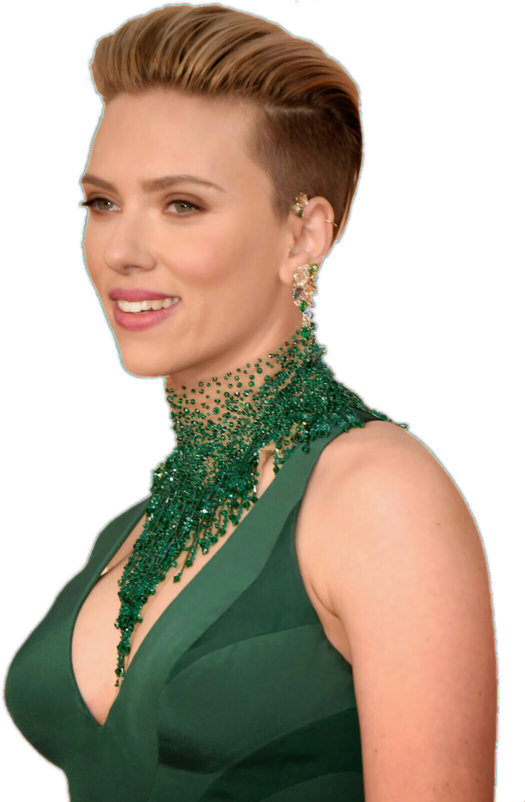 a woman wearing a green dress and necklace