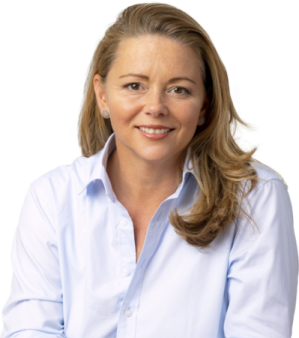 a woman in a blue shirt smiles at the camera