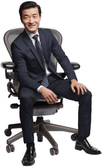 a man in a suit sitting on a chair