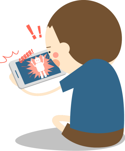a boy sitting on the floor looking at his phone